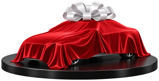 A vehicle wrapped in a red satin cover with a white bow, waiting to be revealed on a display platform